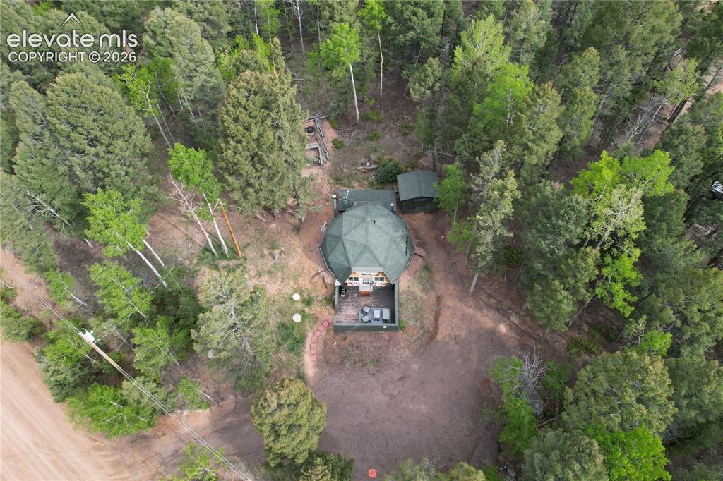 Image 27 of 29: Dome-shaped residence featuring an enclosed deck