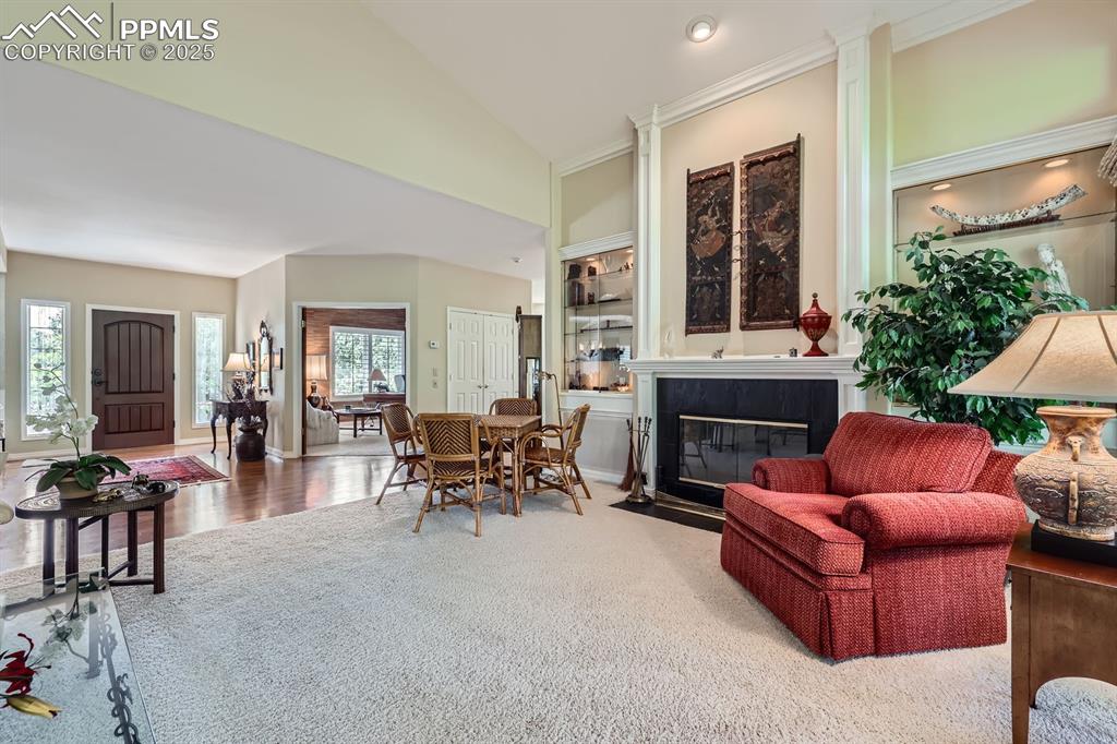 Image 10 of 49: LIVING ROOM OFF THE FOYER CUSTOM LIGHTED BUILT IN CABINETS GAS FIREPLACE