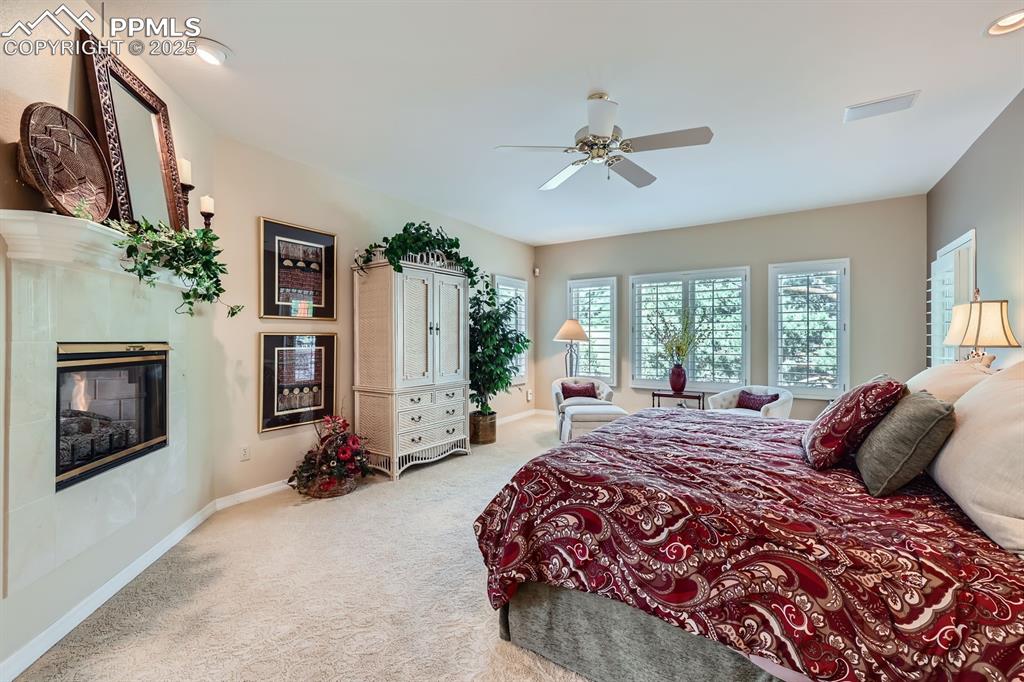 Image 14 of 49: Primary suite with walk out to expansive patio and water feature, dual side