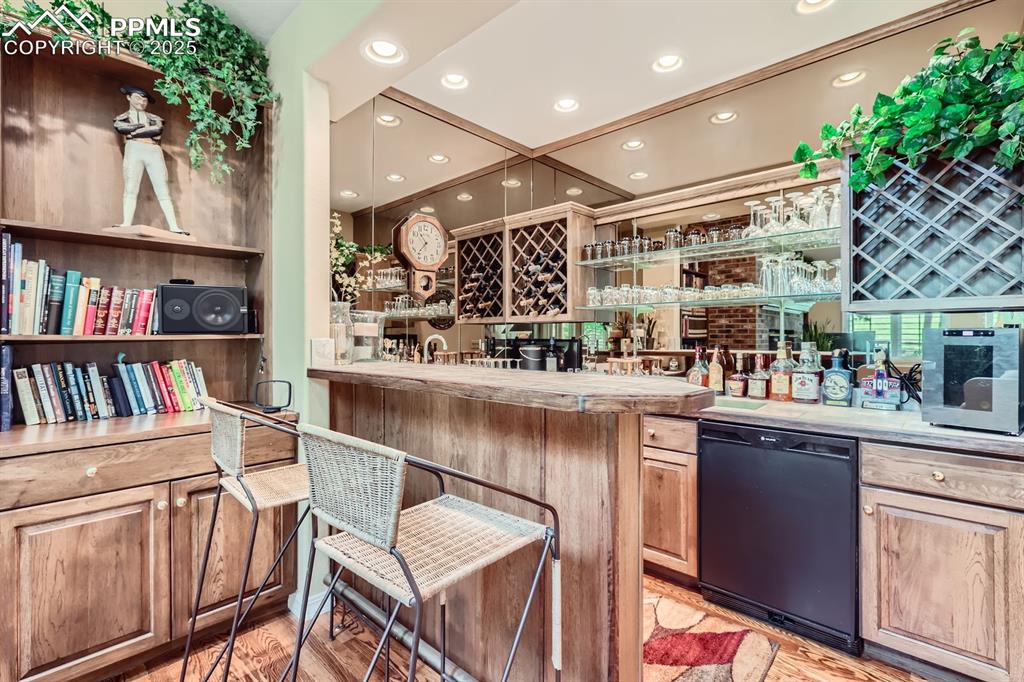 Image 26 of 49: Bar off the family room perfect for gatherings
