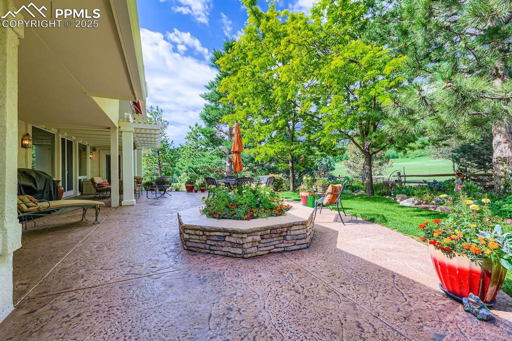 Image 29 of 49: stamped concrete patio and electric awning