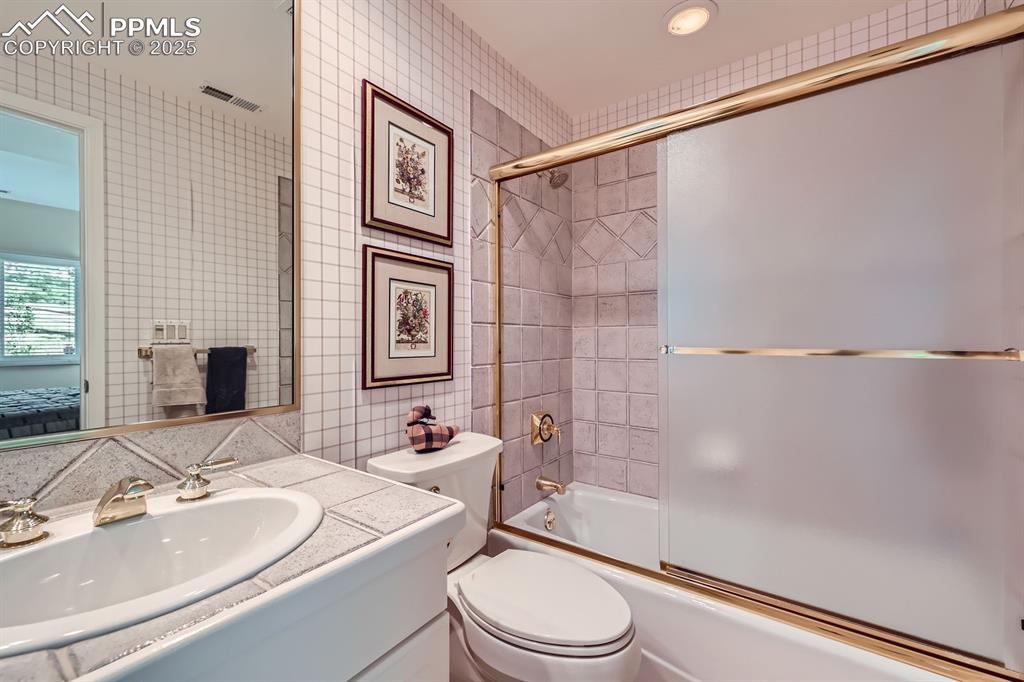 Image 36 of 49: Full bath in basement bedroom suite