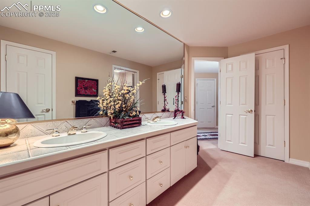 Image 38 of 49: Jack and jill bath serving two bedrooms in basement and family room