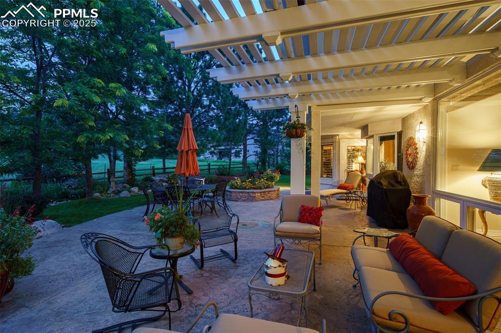 Image 41 of 49: Pergola is another fabulous feature in this amazing outdoor space