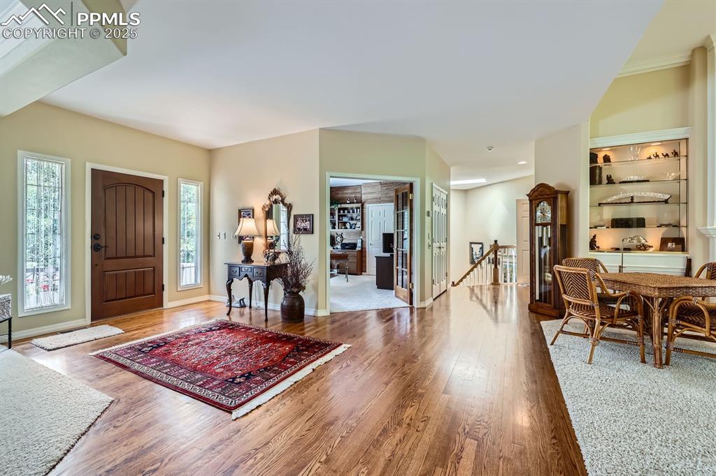 Image 6 of 49: Custom newer front door natural light throughout the home, multiple skyligh
