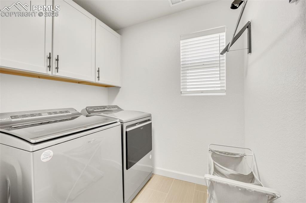 Image 34 of 37: laundry with window near bedrooms