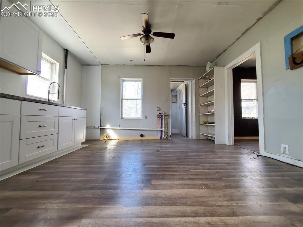 Image 11 of 28: Kitchen with Ceiling Fan (Looking from Living Room Towards Back of House)