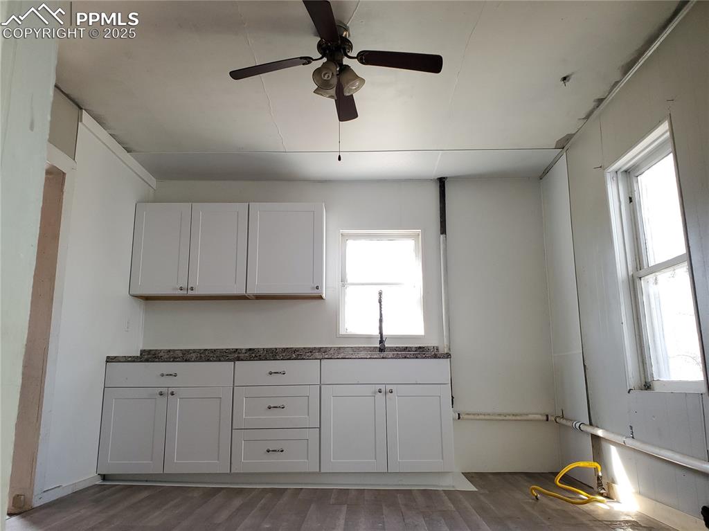 Image 12 of 28: Kitchen with Ceiling Fan