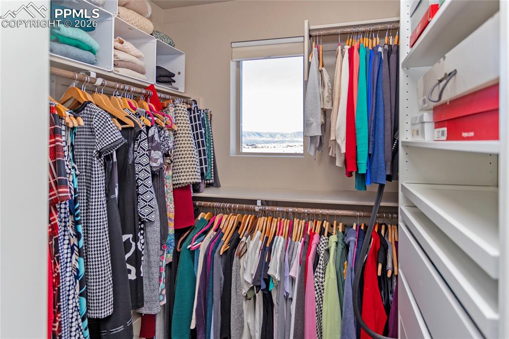 Image 20 of 36: Walk In Closet w/ Custom Built-In
