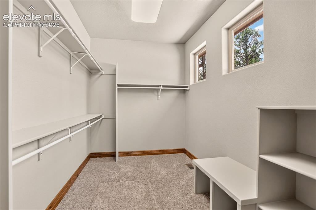 Image 18 of 48: Primary closet
