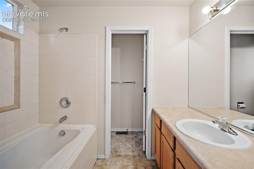 Image 16 of 26: Primary Bathroom with Double Vanity Sink