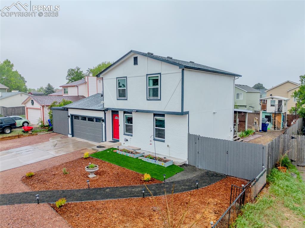 Image 3 of 33: Large lot size with new fence, spacious workable back yard with playhouse, 