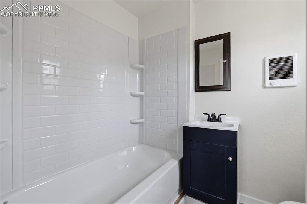 Image 31 of 36: Full bath featuring vanity and shower / bathtub combination