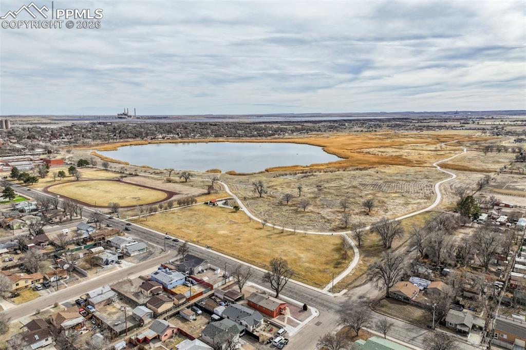 Image 34 of 36: Aerial view of residential area with a nearby body of water
