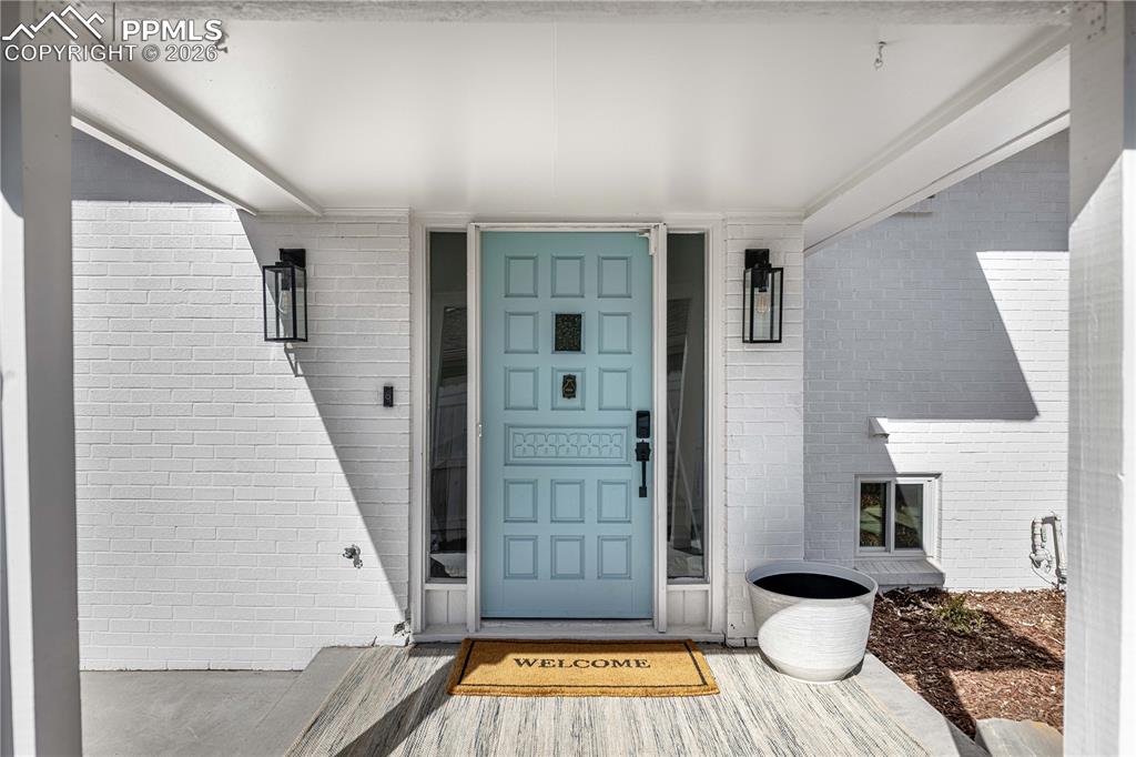 Image 3 of 42: Private, covered front entry