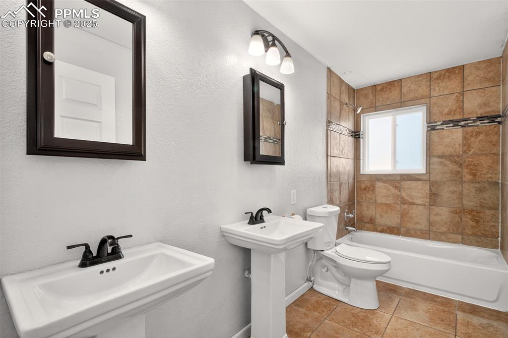 Image 22 of 46: Main level hall bath