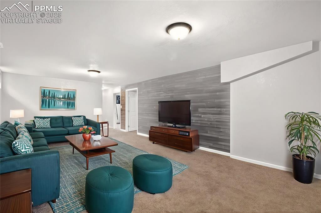Image 24 of 46: Virtually Staged Basement living room