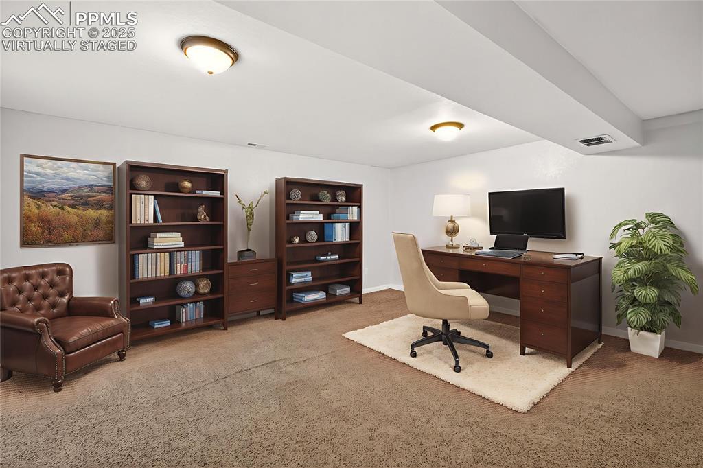 Image 27 of 46: Virtually Staged Basement rec room