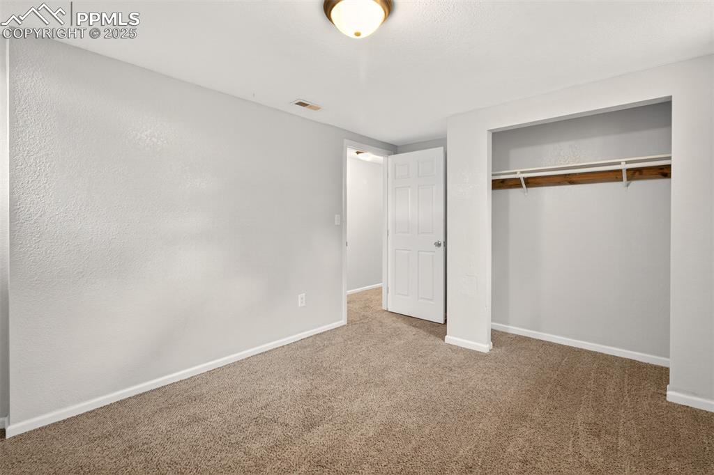 Image 37 of 46: Basement bedroom