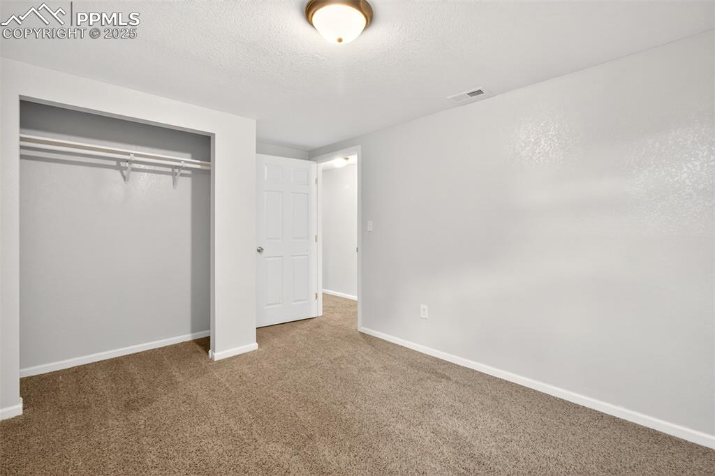 Image 39 of 46: Basement bedroom