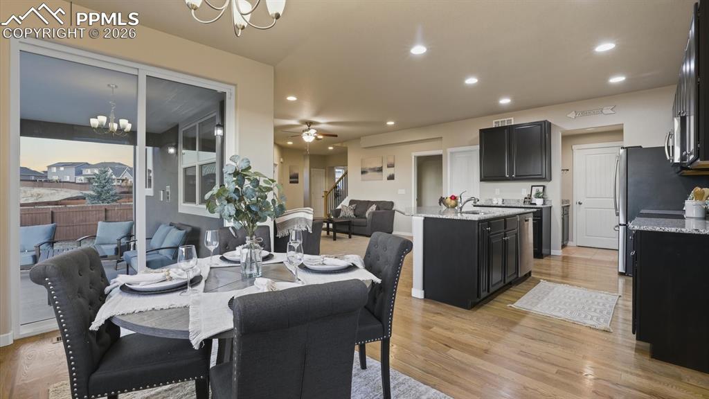 Image 17 of 50: Covered backyard patio for outdoor dining and relaxation.