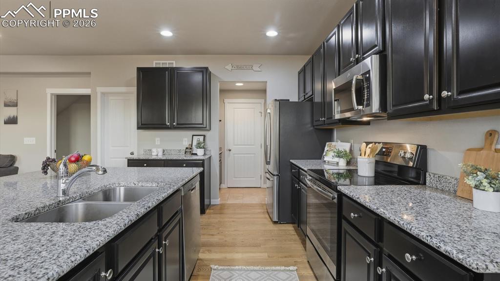 Image 18 of 50: Backyard covered patio.