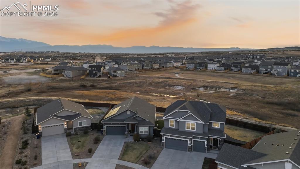 Image 2 of 50: Impressive 5BR, 4BA stucco home with stone accents on a 0.18-acre lot in de