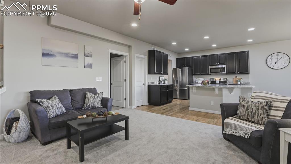 Image 20 of 50: Stainless steel appliances include a smooth top range oven, microwave, dish