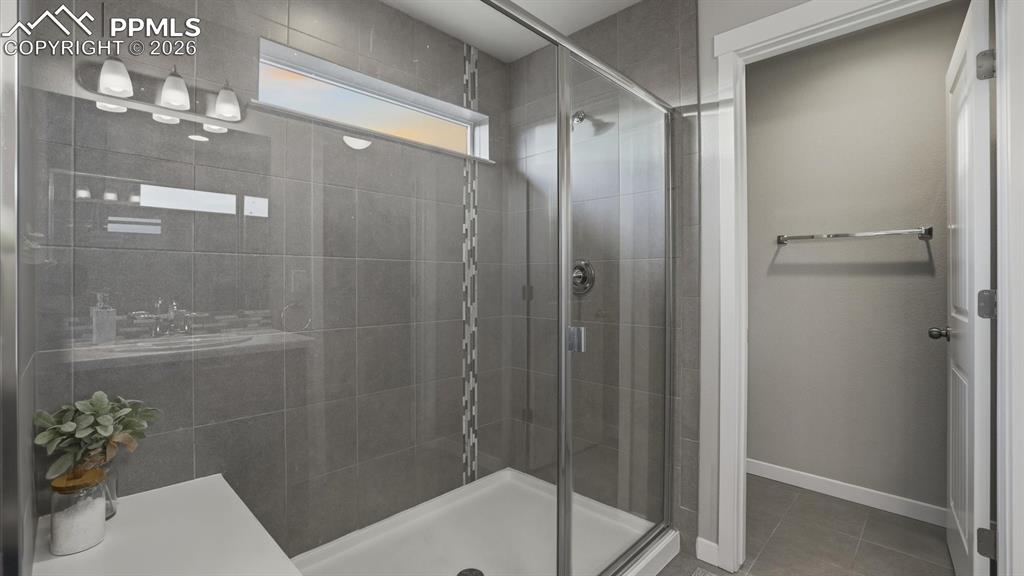 Image 26 of 50: View into the Primary Shower Bathroom from the Primary Bedroom.