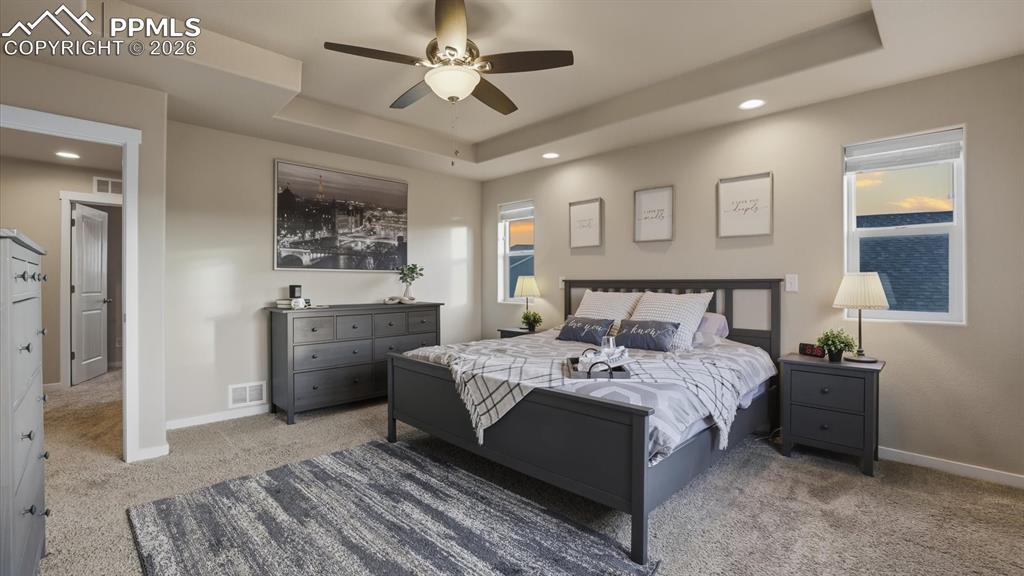 Image 28 of 50: Enclosed tiled shower with built in seat and toilet room in the Primary Bat