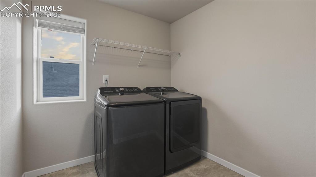 Image 29 of 50: View of walk in closet and Primary Bedroom from the Primary Bathroom.
