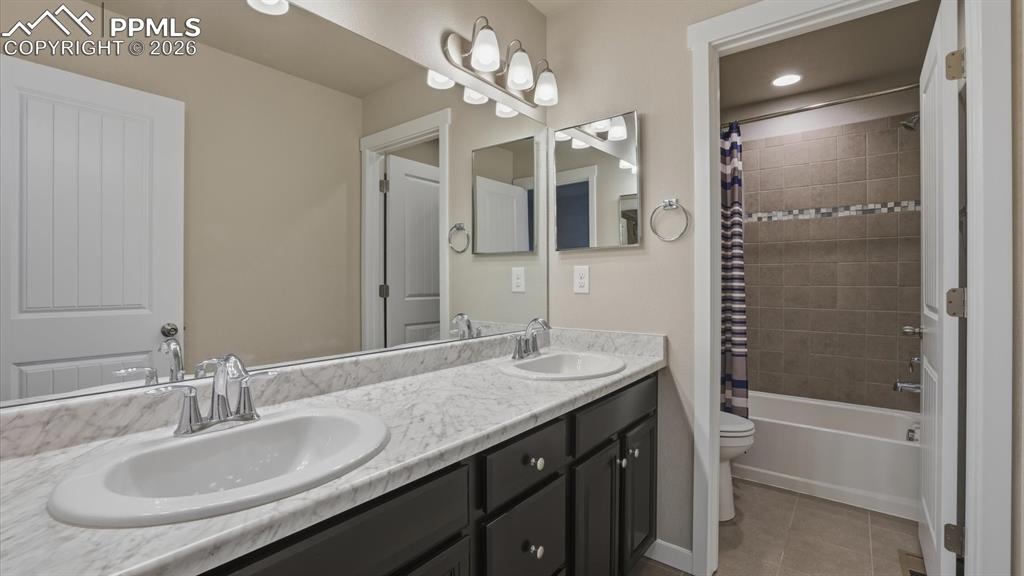 Image 34 of 50: Upper Level Bedroom #3 has neutral carpet.