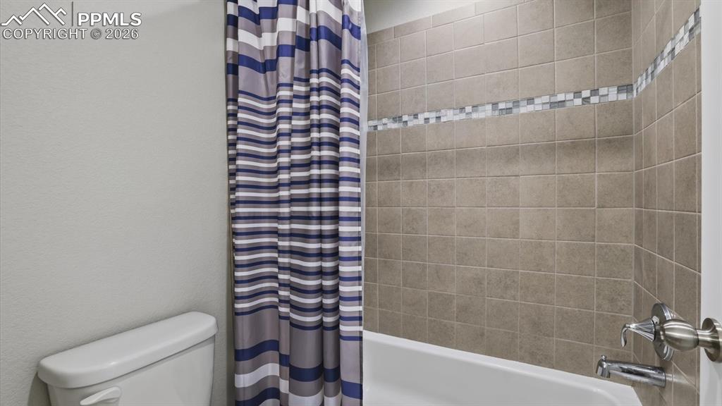 Image 35 of 50: Upper Level Bedroom #3 has a generous closet.