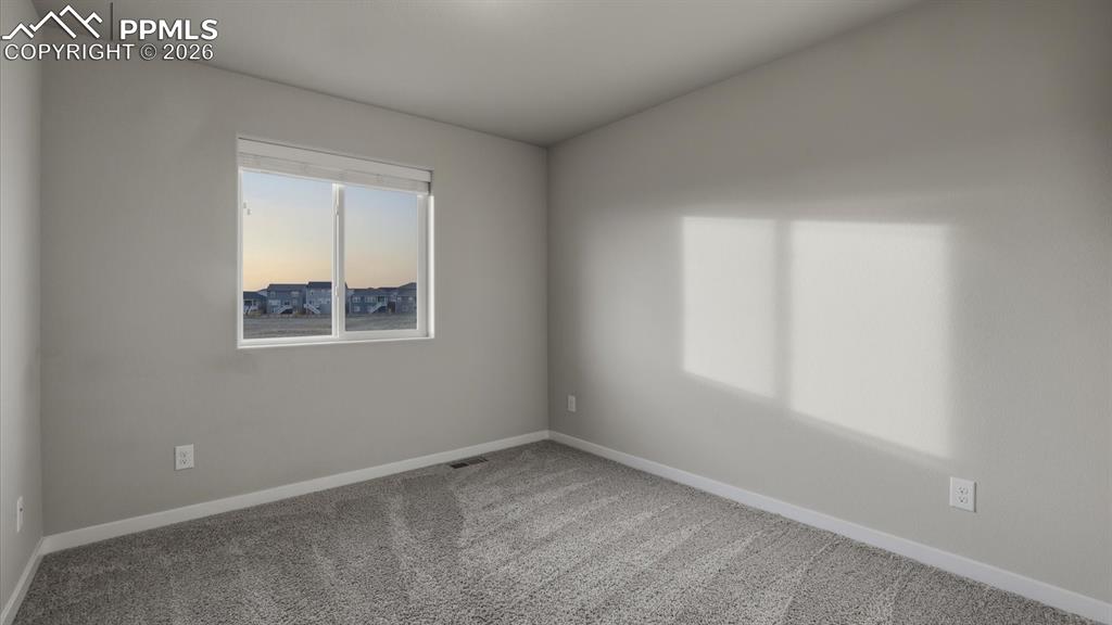 Image 36 of 50: Upper Level Hall Bathroom with a dual sink vanity mirror, and tiled tub/sho