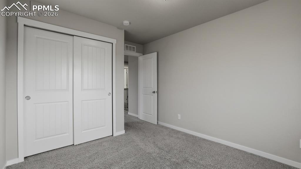 Image 37 of 50: Tiled tub/shower in upper level Full Hall Bathroom.