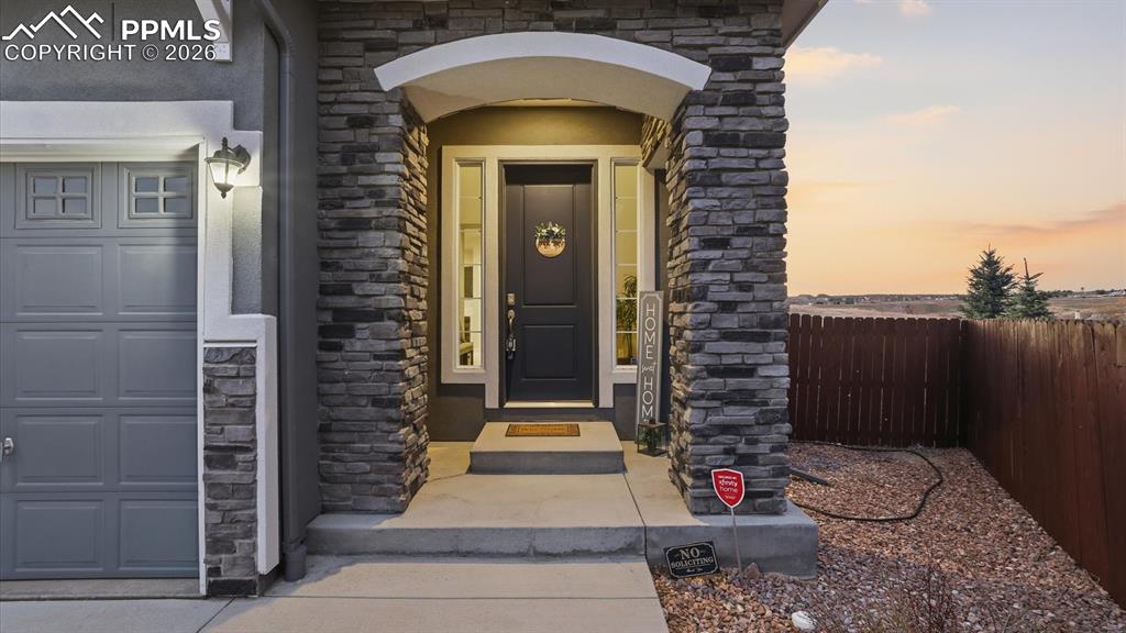 Image 4 of 50: View of home and open space with walking trails behind the home.