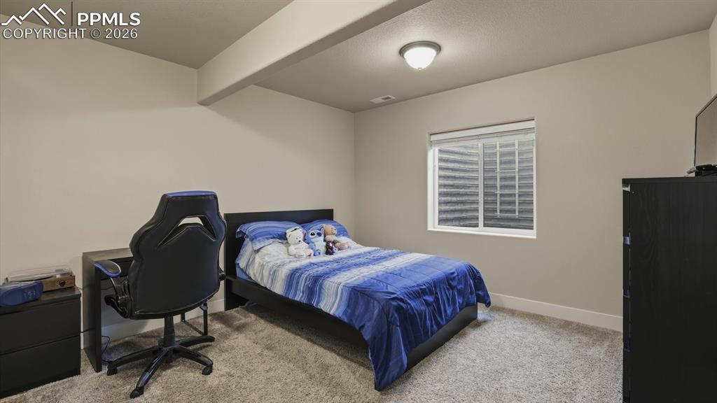 Image 45 of 50: The finished Basement is versatile living space that can be used as a media