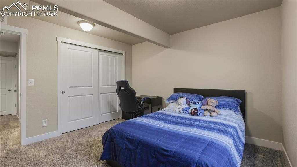 Image 46 of 50: Basement Full Bathroom with vanity, mirror, and tiled tub/shower.