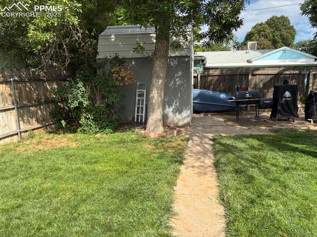 Image 10 of 12: View of yard with a shed