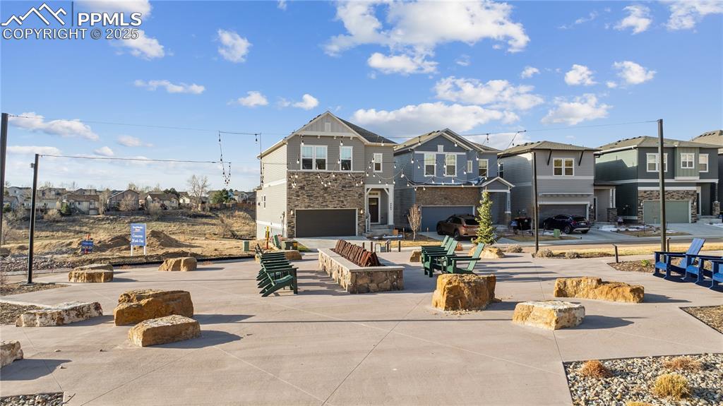 Image 4 of 40: FRONT EXTERIOR. HUGE FIRE PIT AND SEATING FOR SOCIAL GATHERINGS