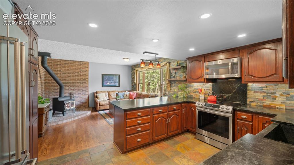 Image 14 of 42: Hearth Room adjoins the kitchen!