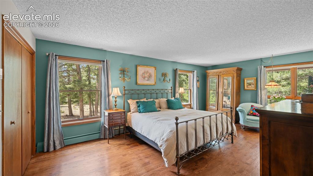 Image 16 of 42: Main Level Master Suite! Gorgeous Genuine Hardwood Floors * Sitting Area * 