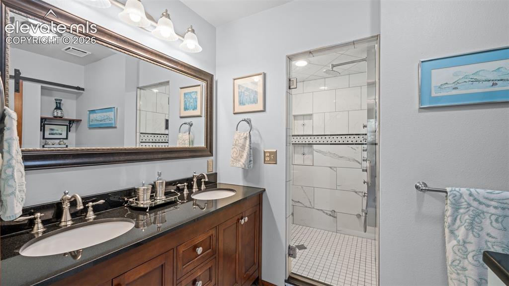 Image 19 of 42: Steam Shower! Double Vanities * Attached to Main Level Master Bedroom