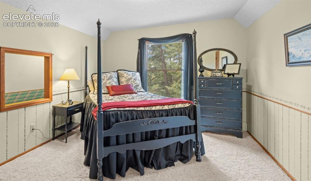 Image 21 of 42: Upper Level Bedroom with extra storage or opening pictured is perfect for p