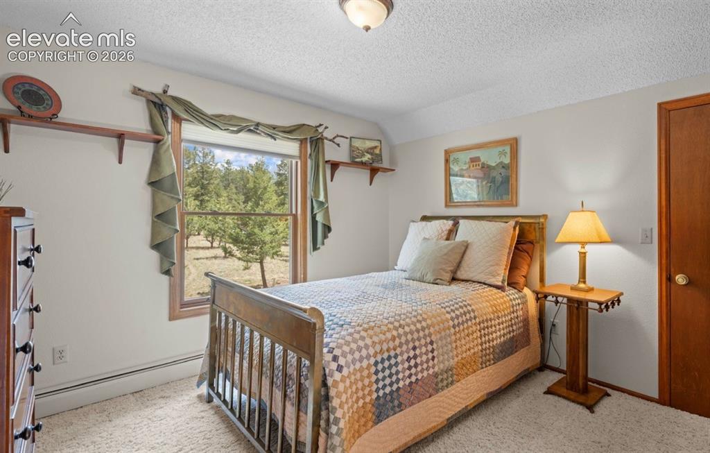 Image 23 of 42: Upper Level Bedroom with lots of storage!