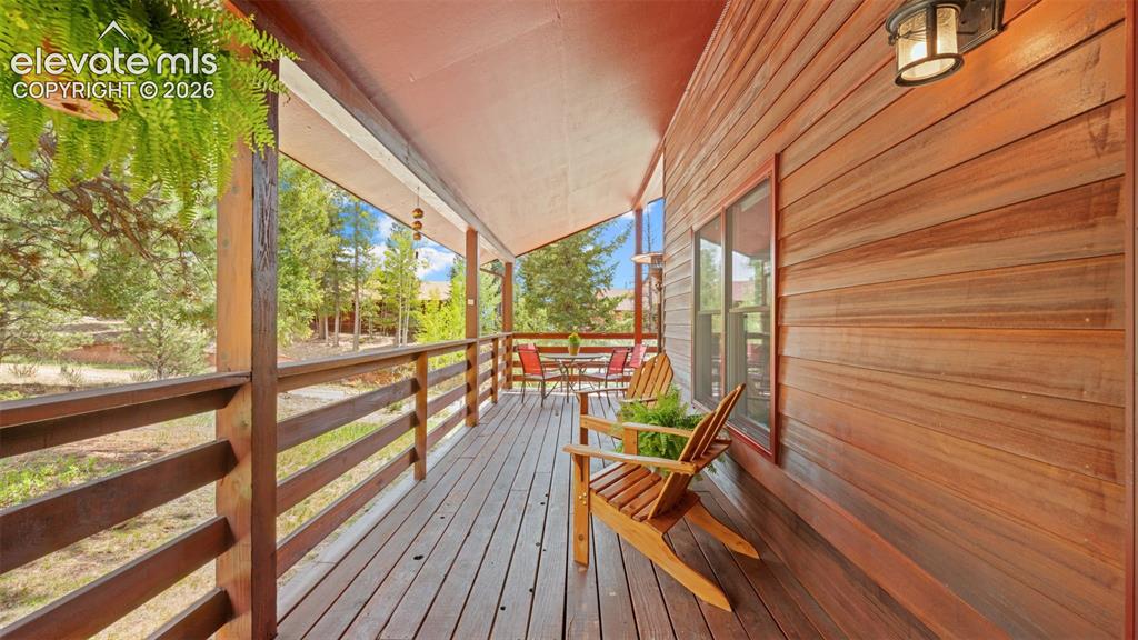 Image 25 of 42: Covered Redwood Deck serves for year round enjoyment! Perfect for entertain