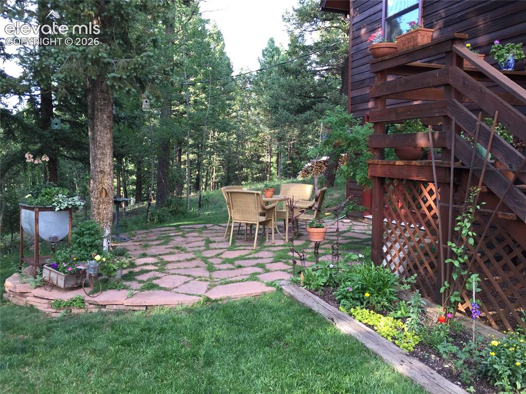 Image 5 of 42: Flagstone patoio- a perfect place to enjoy your natural surroundings!