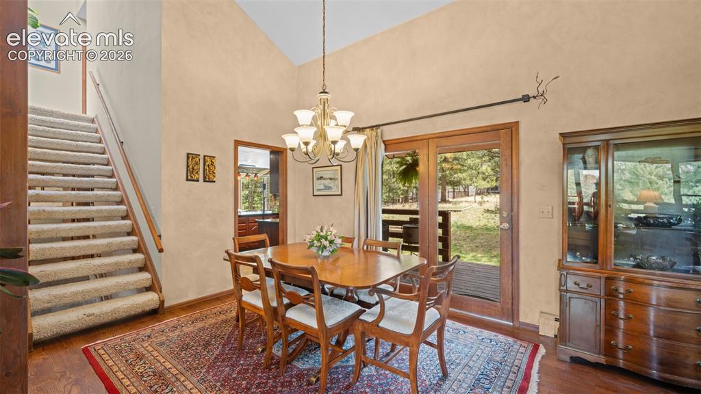 Image 9 of 42: Adjacent to the Great Room and walks out to covered deck. A pocket door to 