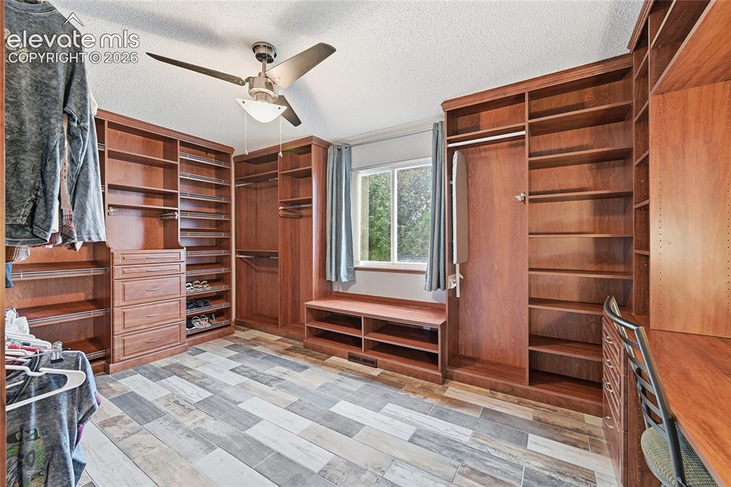 Image 19 of 50: Primary walk-in closet