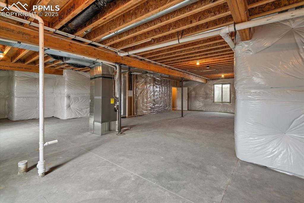 Image 38 of 45: Below grade area featuring heating unit